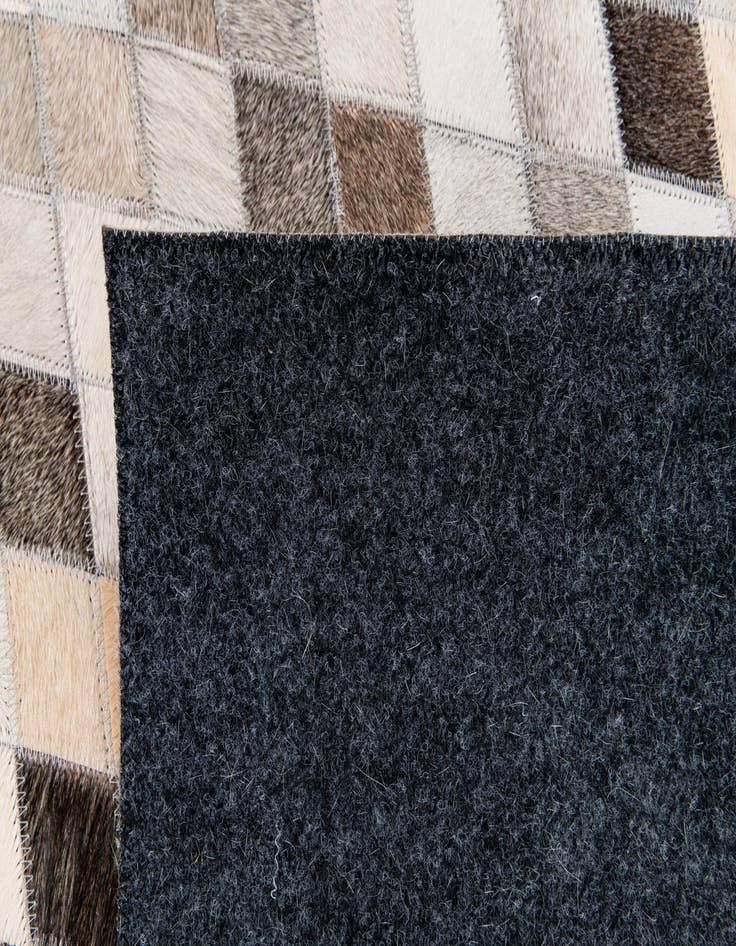 Detail image of  5' 6 x 8' Cowhide Stocks Rug