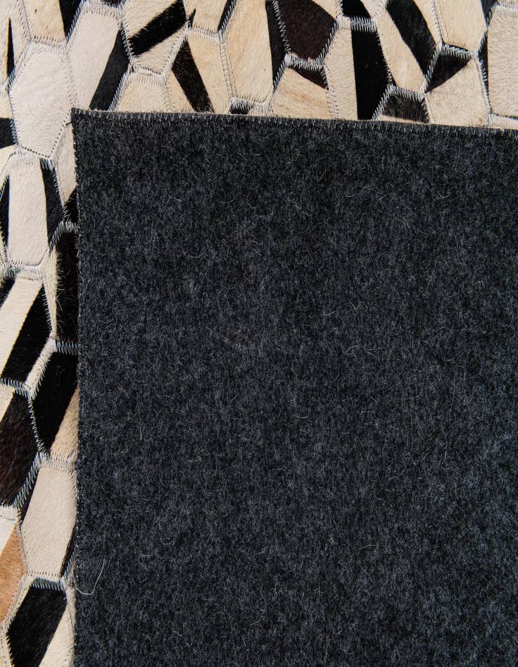 Detail image of  5' 1 x 7' 11 Cowhide Stocks Rug