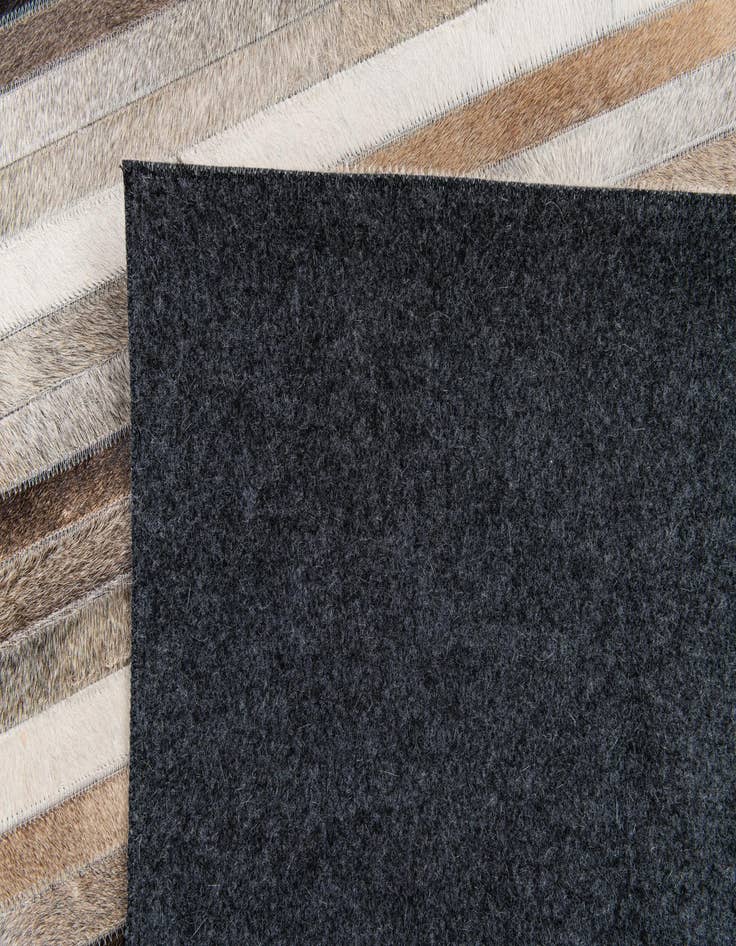 Detail image of  5' 1 x 8' Cowhide Stocks Rug