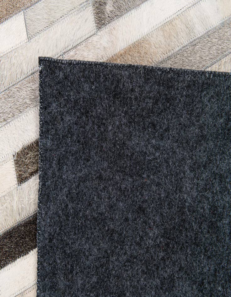 Detail image of  5' 1 x 7' 11 Cowhide Stocks Rug