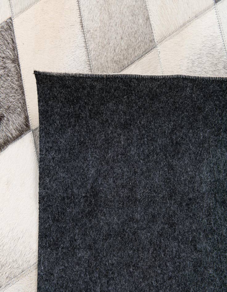 Detail image of  5' x 7' 11 Cowhide Stocks Rug