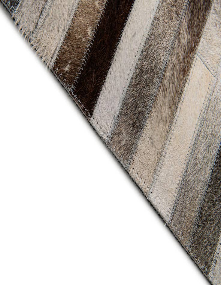 Detail image of  5' 1 x 7' 11 Cowhide Stocks Rug