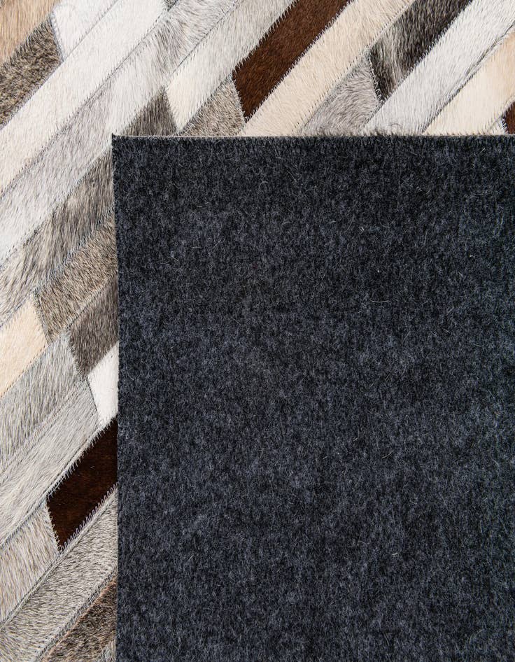 Detail image of  5' 1 x 7' 11 Cowhide Stocks Rug