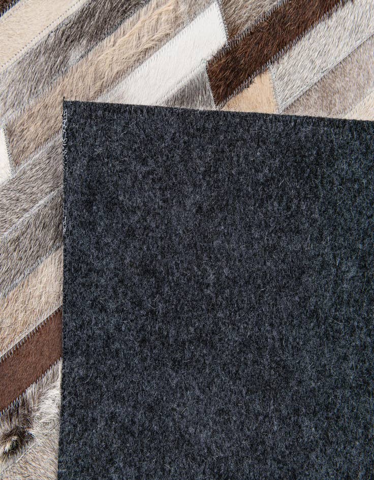 Detail image of  5' 1 x 7' 11 Cowhide Stocks Rug
