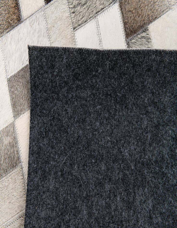 Detail image of  5' 1 x 8' Cowhide Stocks Rug
