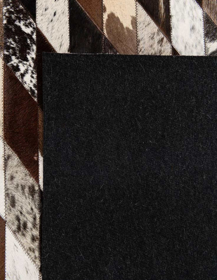 Detail image of  5' 2 x 8' Cowhide Stocks Rug