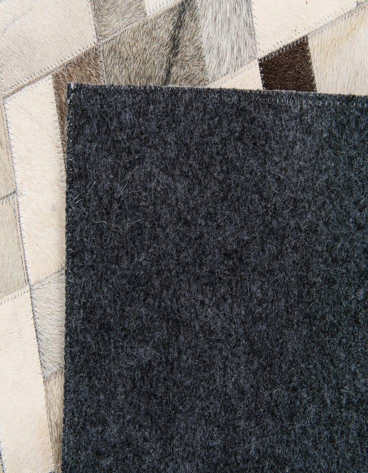 Detail image of  5' x 7' 11 Cowhide Stocks Rug