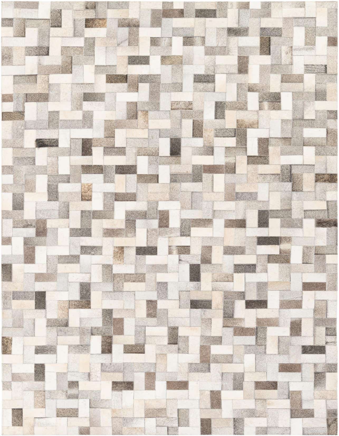 A 5x8 rectangular Cowhide Stocks rug from Rugs.com, featuring a modern patchwork pattern of multi-colored cowhide and leather rectangles in varying shades of brown, grey, and white.