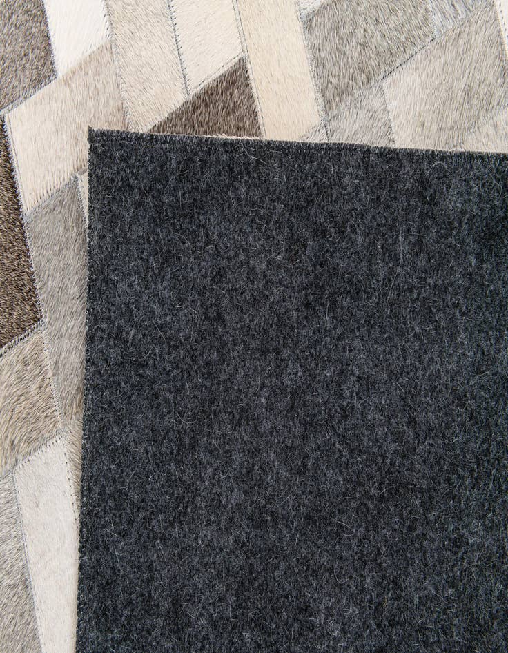 Detail image of  5' 1 x 8' Cowhide Stocks Rug