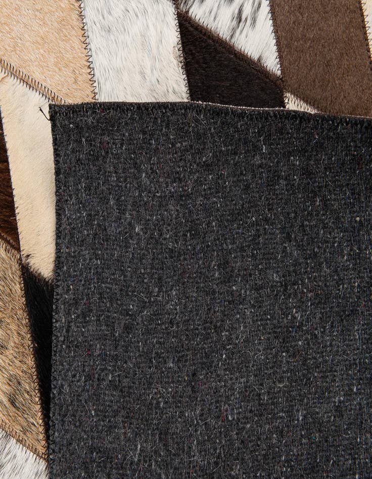 Detail image of  5' 1 x 8' 1 Cowhide Stocks Rug