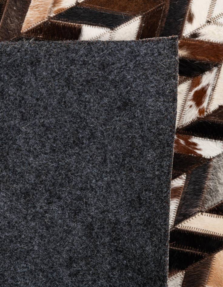 Detail image of  4' 11 x 8' Cowhide Stocks Rug