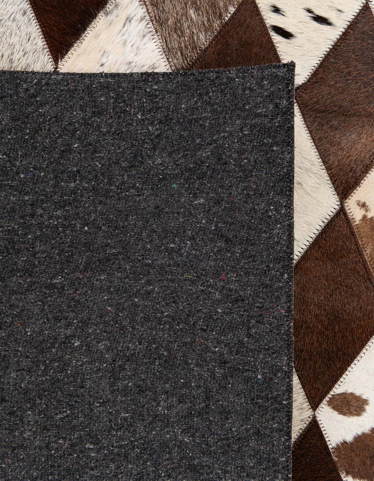 Detail image of  5' 1 x 8' 1 Cowhide Stocks Rug