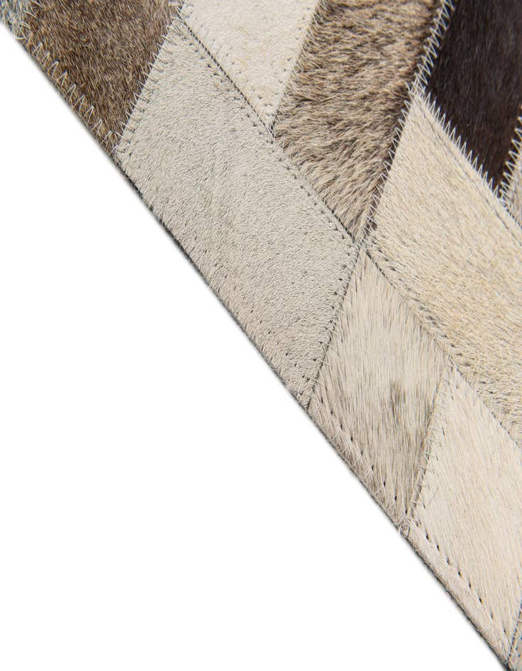 Detail image of  5' x 7' 11 Cowhide Stocks Rug