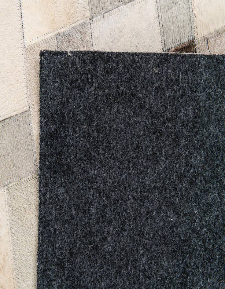 Detail image of  5' x 7' 11 Cowhide Stocks Rug
