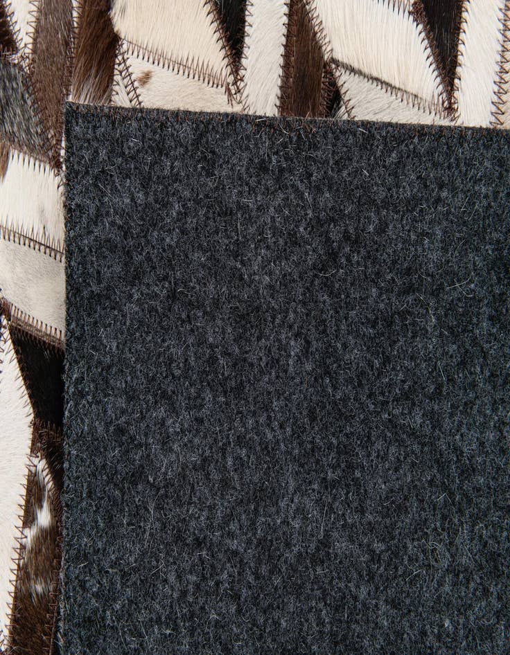 Detail image of  4' 11 x 7' 10 Cowhide Stocks Rug