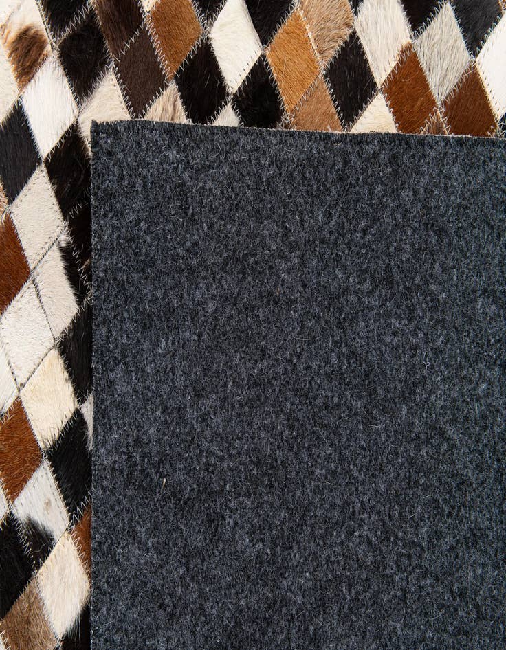 Detail image of  5' 3 x 7' 7 Cowhide Stocks Rug