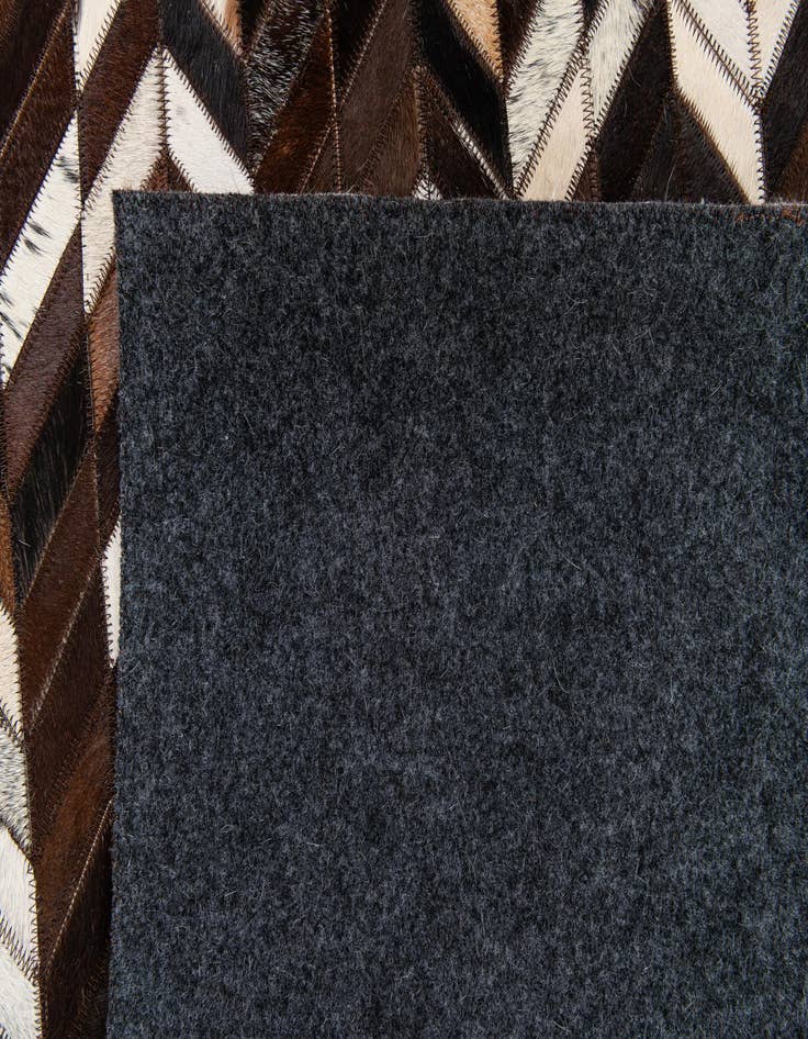 Detail image of  4' 11 x 8' Cowhide Stocks Rug