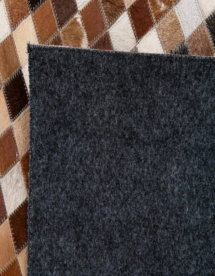 Detail image of  5' 1 x 7' 10 Cowhide Stocks Rug