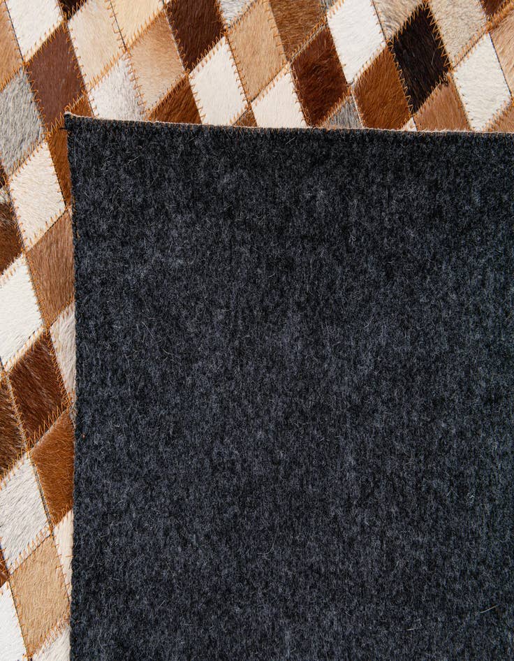 Detail image of  5' 2 x 8' Cowhide Stocks Rug