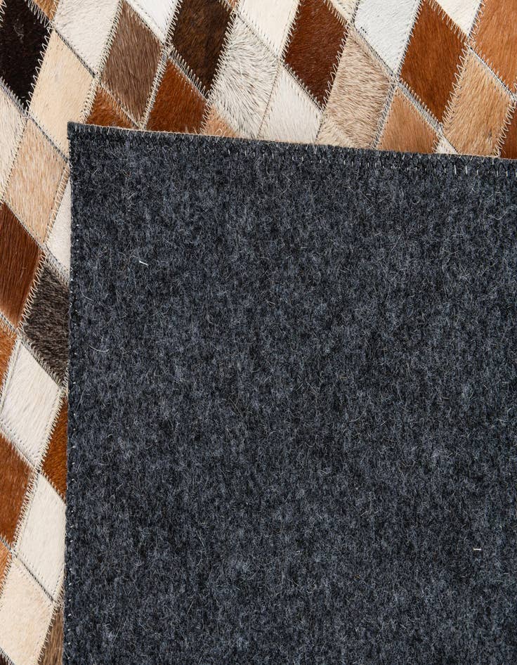 Detail image of  5' 1 x 7' 11 Cowhide Stocks Rug