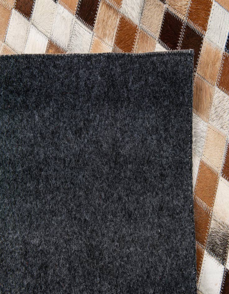 Detail image of  5' 1 x 7' 11 Cowhide Stocks Rug