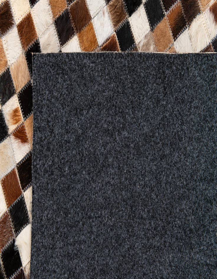 Detail image of  5' 3 x 7' 8 Cowhide Stocks Rug