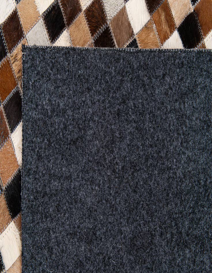 Detail image of  5' 3 x 7' 7 Cowhide Stocks Rug