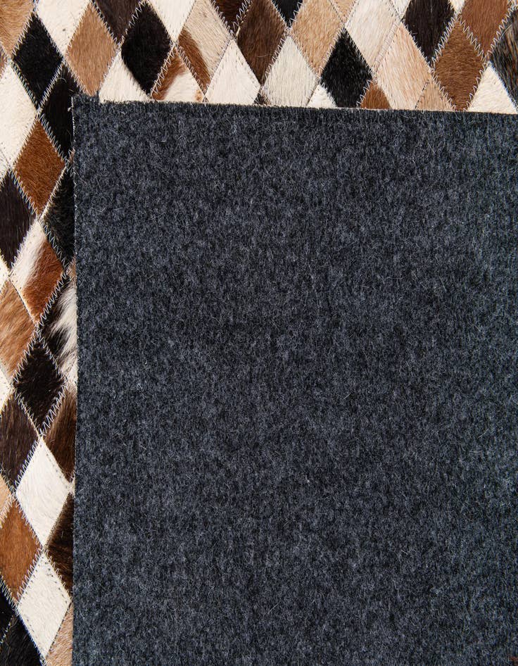 Detail image of  5' 3 x 7' 7 Cowhide Stocks Rug