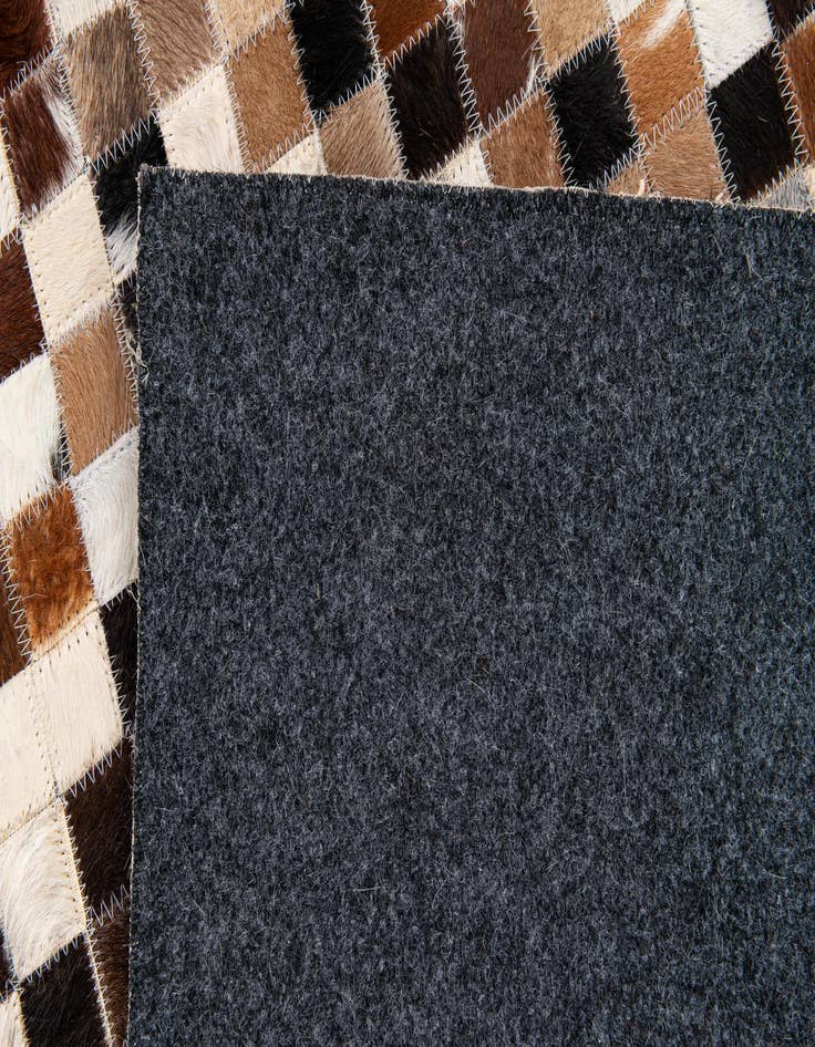 Detail image of  5' 5 x 7' 8 Cowhide Stocks Rug