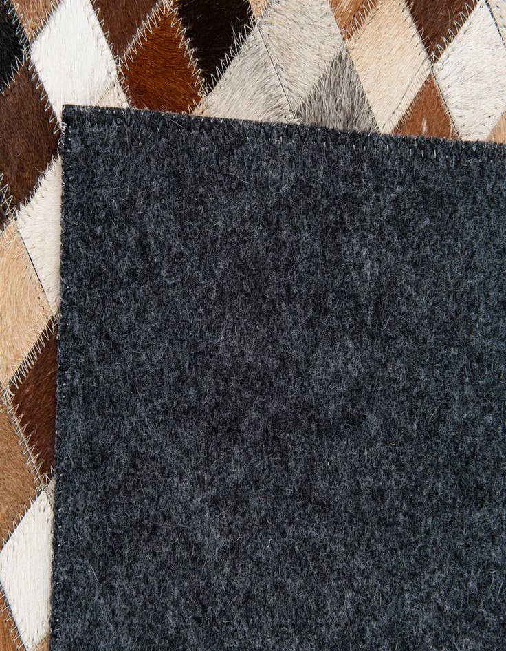 Detail image of  5' x 7' 11 Cowhide Stocks Rug