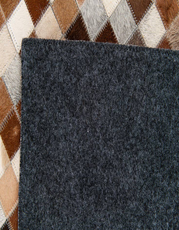 Detail image of  5' x 7' 11 Cowhide Stocks Rug