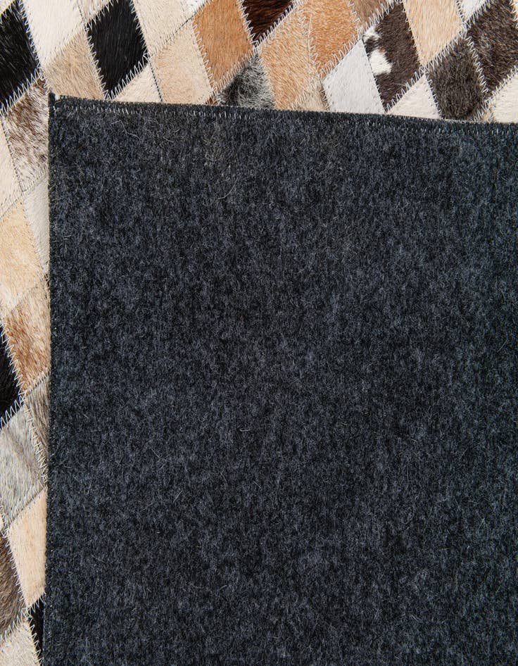 Detail image of  5' x 7' 11 Cowhide Stocks Rug