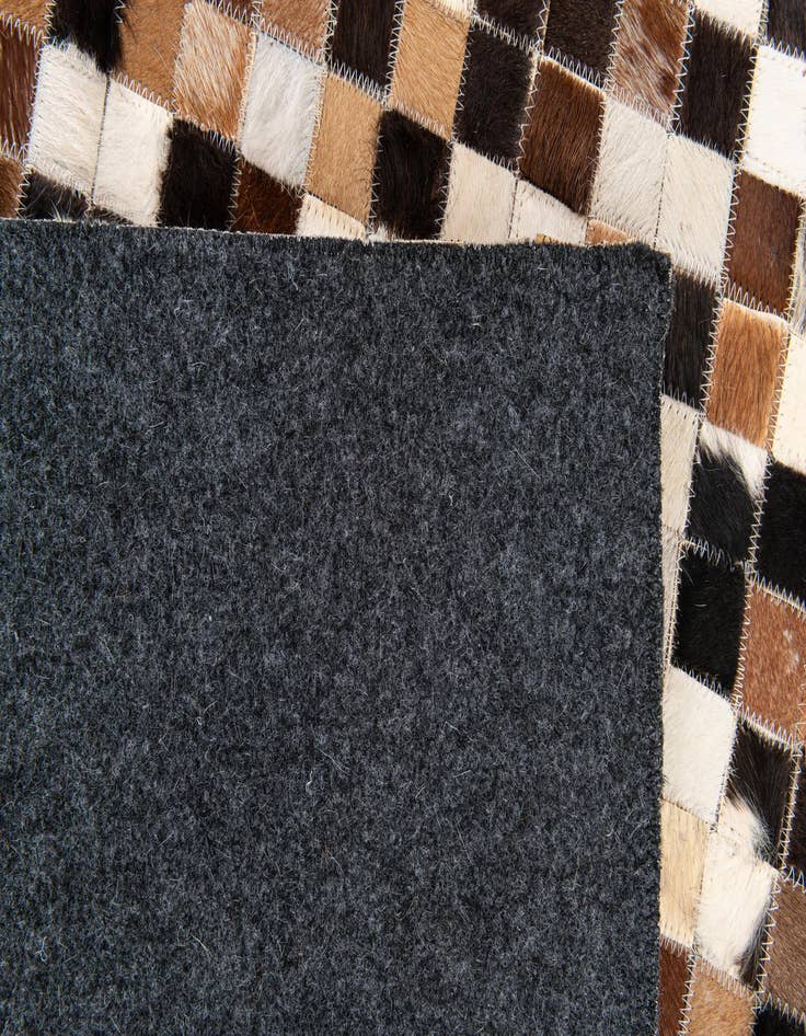 Detail image of  5' 3 x 7' 7 Cowhide Stocks Rug