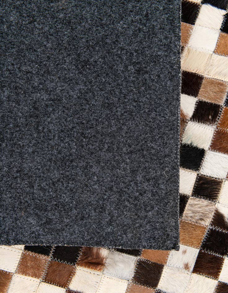 Detail image of  5' 5 x 7' 7 Cowhide Stocks Rug