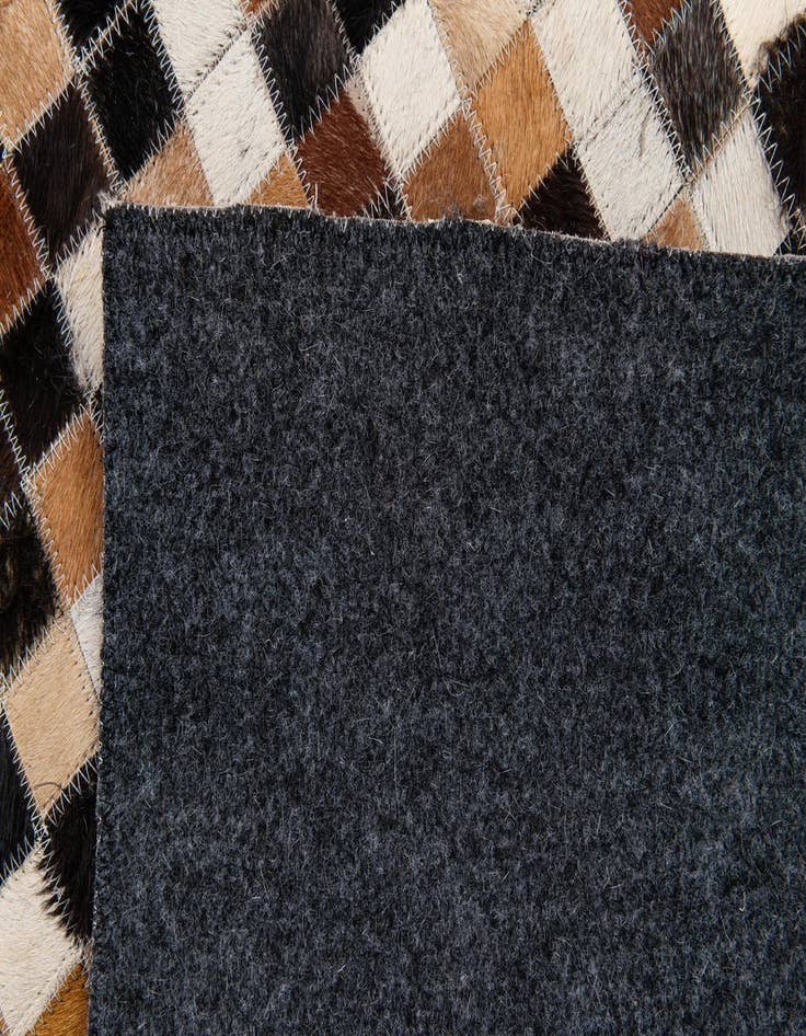 Detail image of  5' 5 x 7' 8 Cowhide Stocks Rug