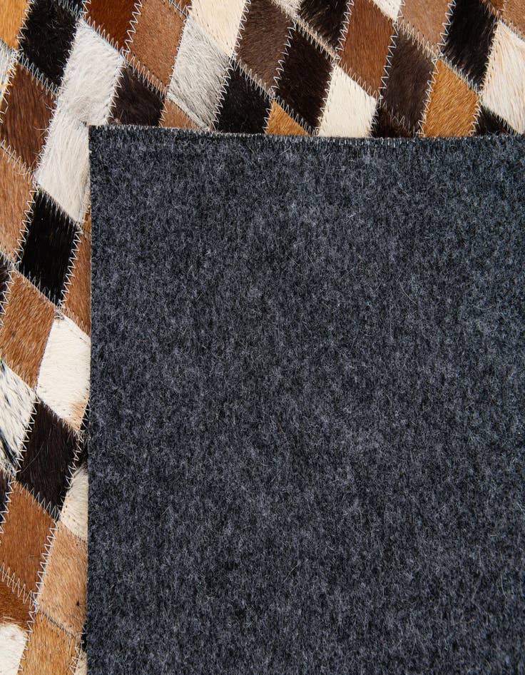 Detail image of  5' 5 x 7' 7 Cowhide Stocks Rug