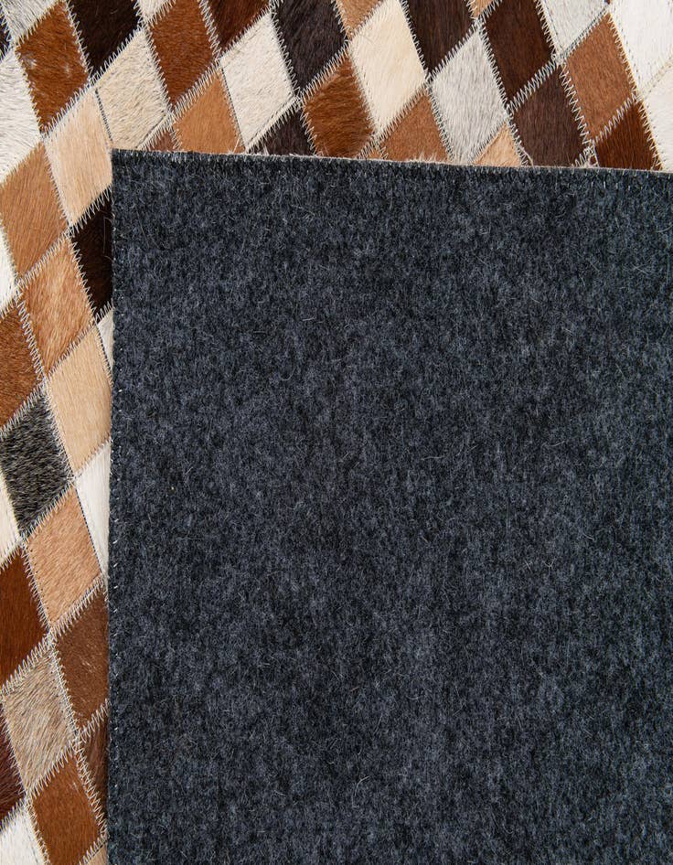 Detail image of  5' 1 x 7' 11 Cowhide Stocks Rug