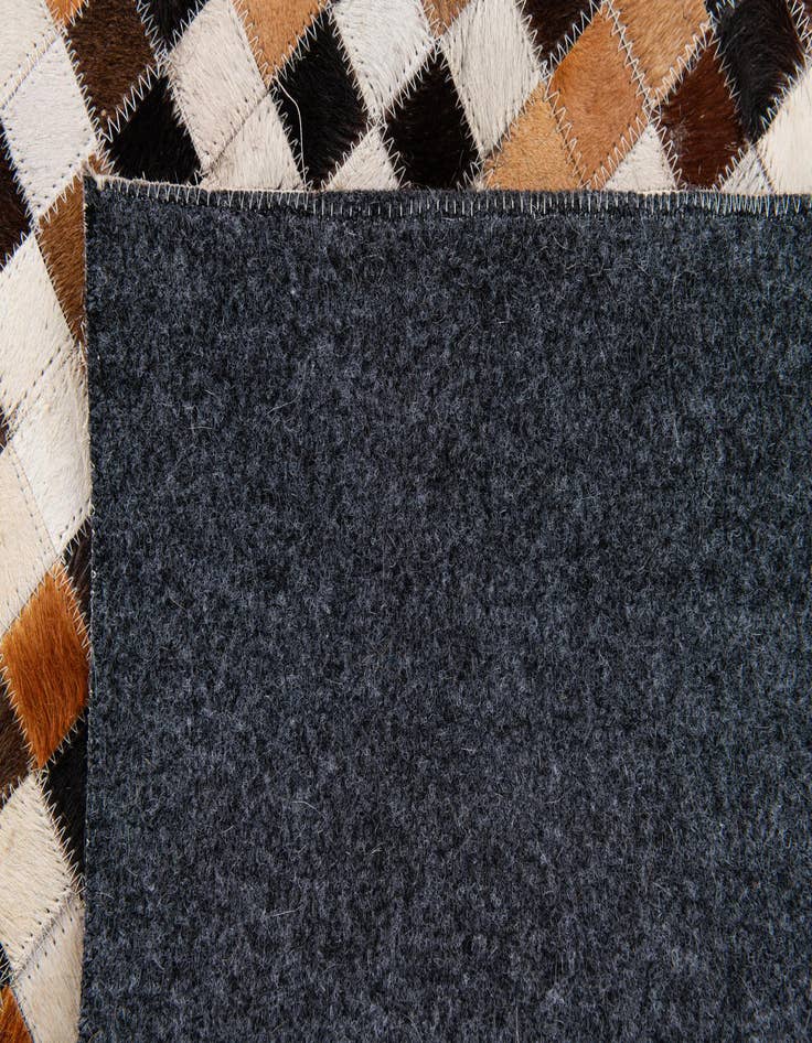 Detail image of  5' 5 x 7' 8 Cowhide Stocks Rug