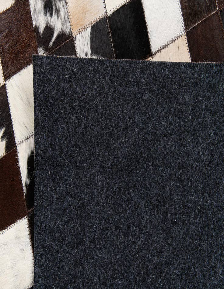 Detail image of  5' x 7' 11 Cowhide Stocks Rug
