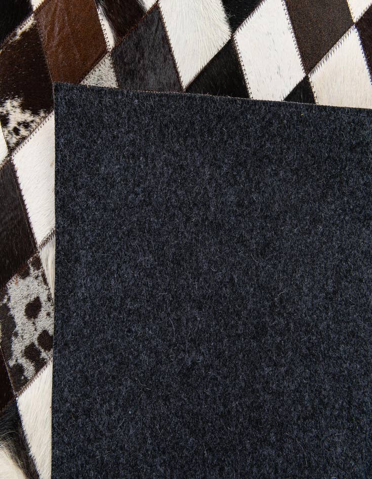 Detail image of  5' 1 x 8' Cowhide Stocks Rug