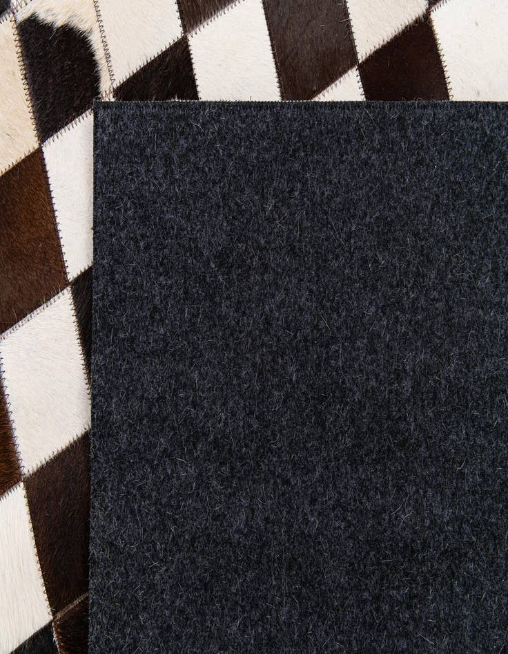 Detail image of  5' 1 x 8' Cowhide Stocks Rug