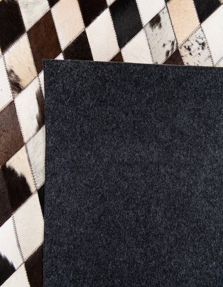 Detail image of  5' 1 x 7' 11 Cowhide Stocks Rug