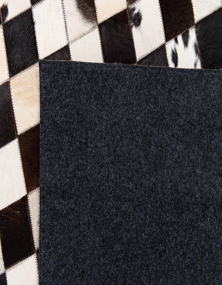 Detail image of  5' x 7' 11 Cowhide Stocks Rug