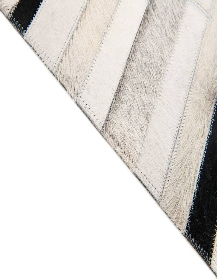 Detail image of  5' 1 x 7' 11 Cowhide Stocks Rug