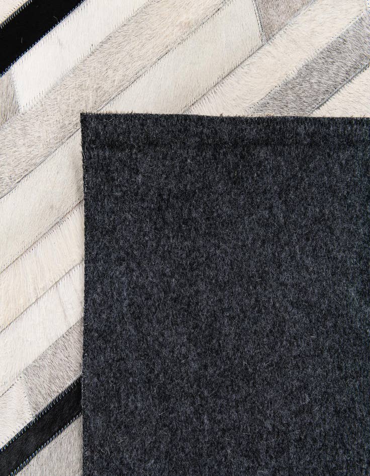 Detail image of  5' 1 x 7' 11 Cowhide Stocks Rug