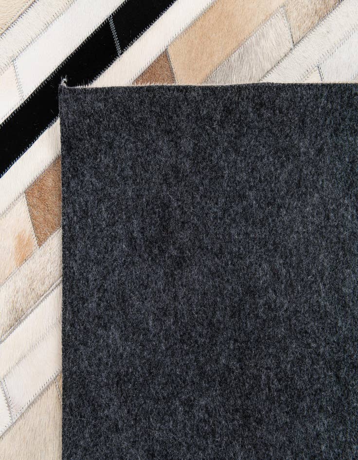 Detail image of  5' 1 x 8' Cowhide Stocks Rug