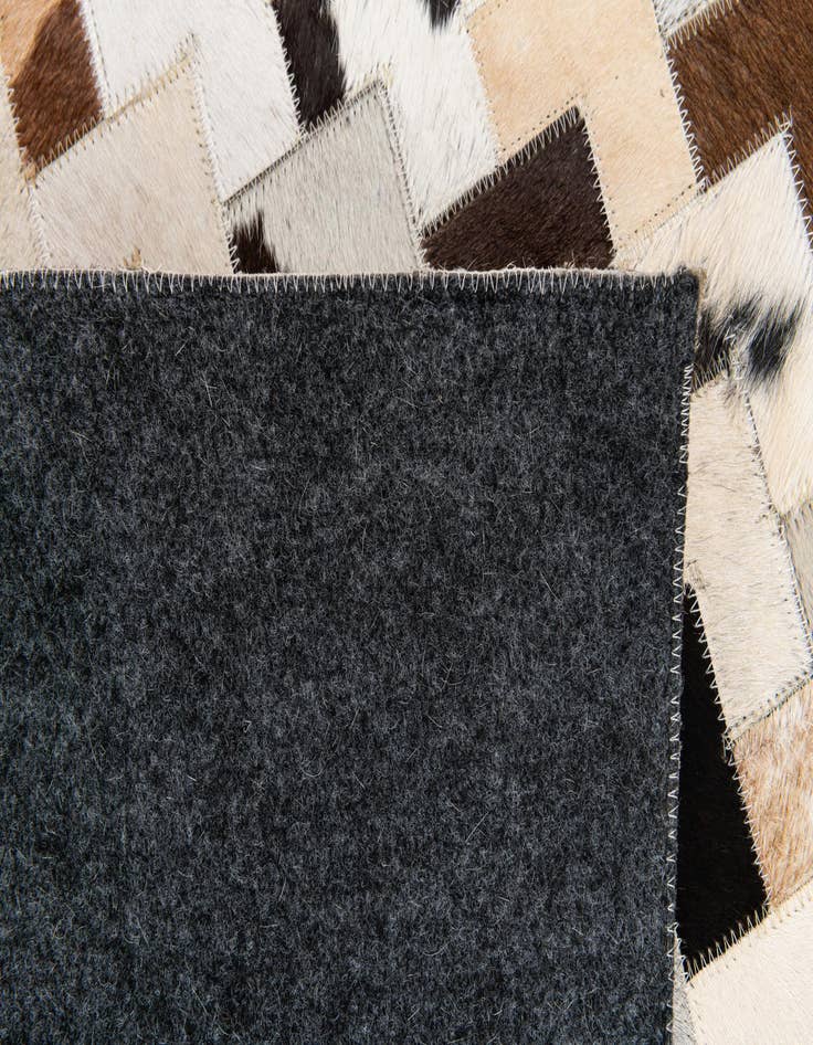 Detail image of  5' 1 x 7' 11 Cowhide Stocks Rug