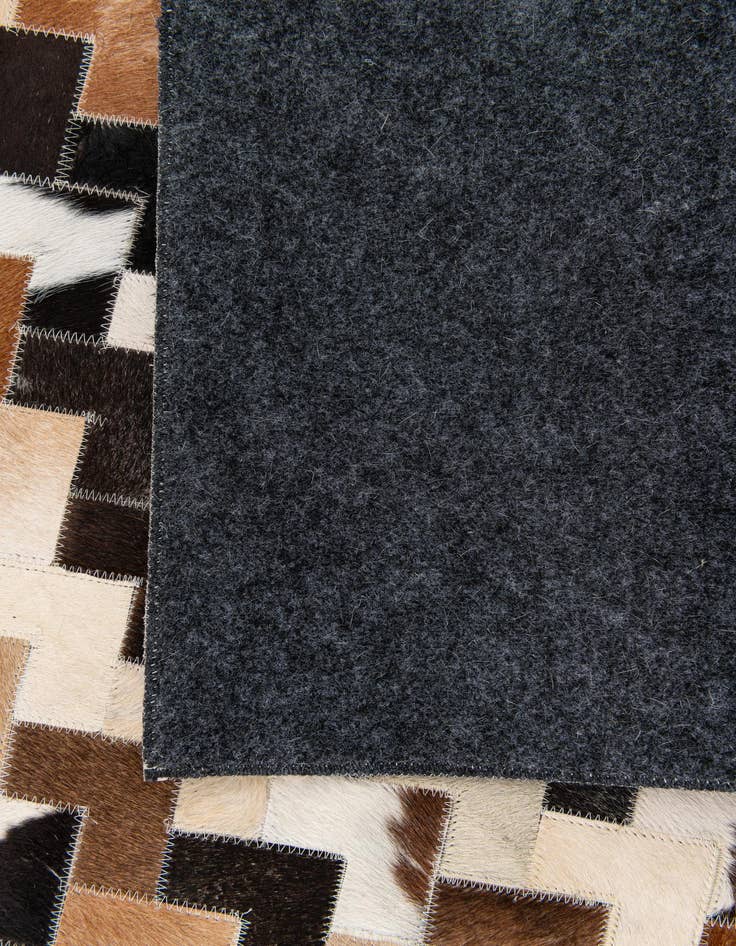 Detail image of  5' 1 x 8' Cowhide Stocks Rug