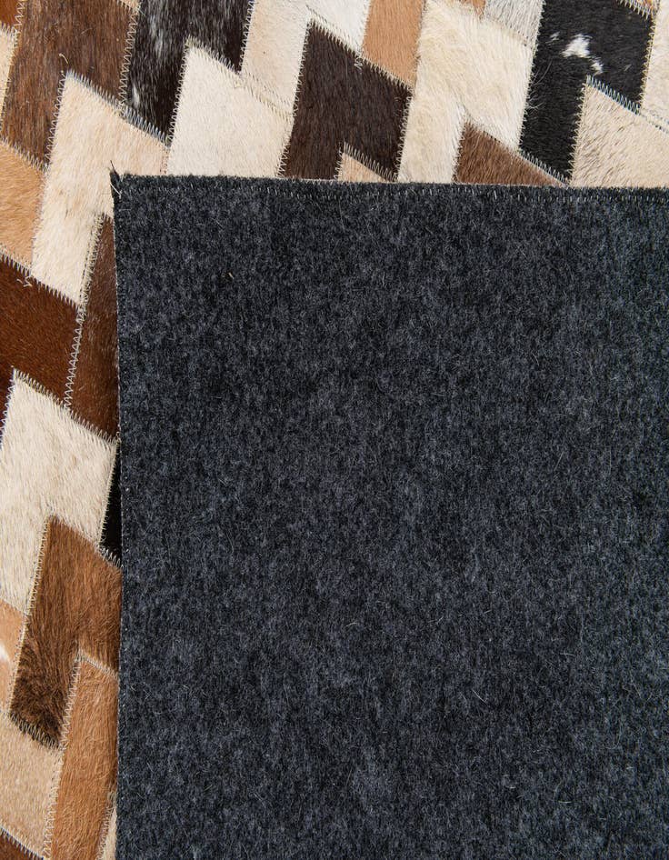 Detail image of  5' 1 x 8' Cowhide Stocks Rug
