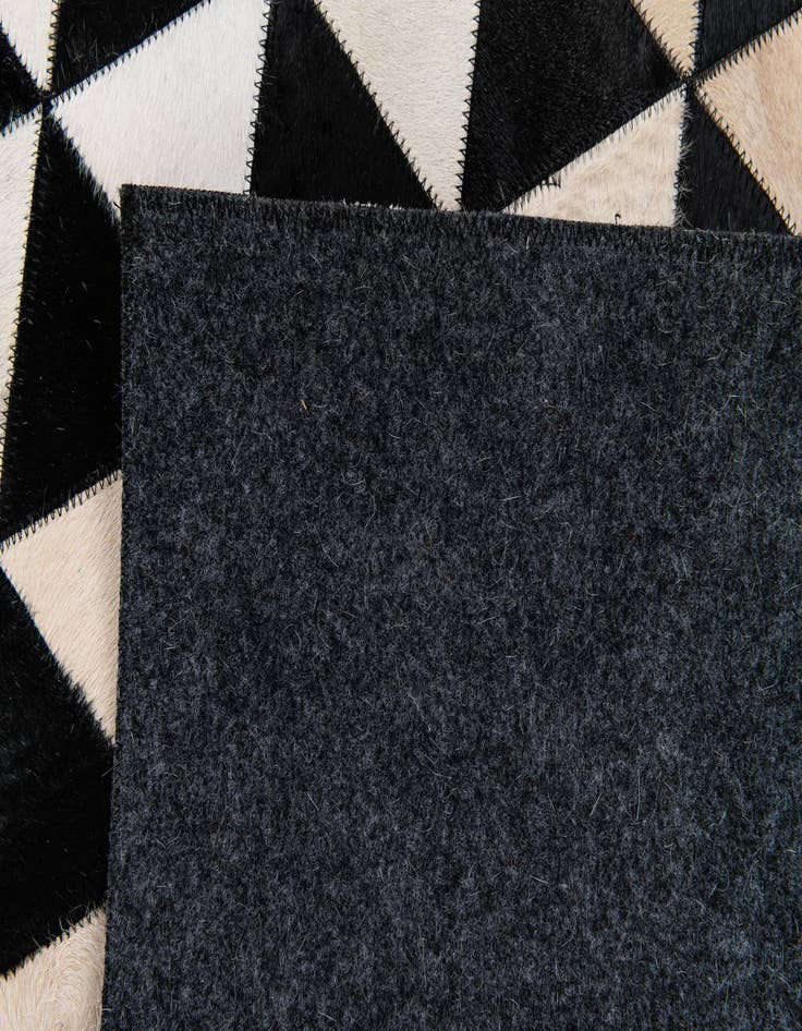 Detail image of  5' 2 x 8' Cowhide Stocks Rug